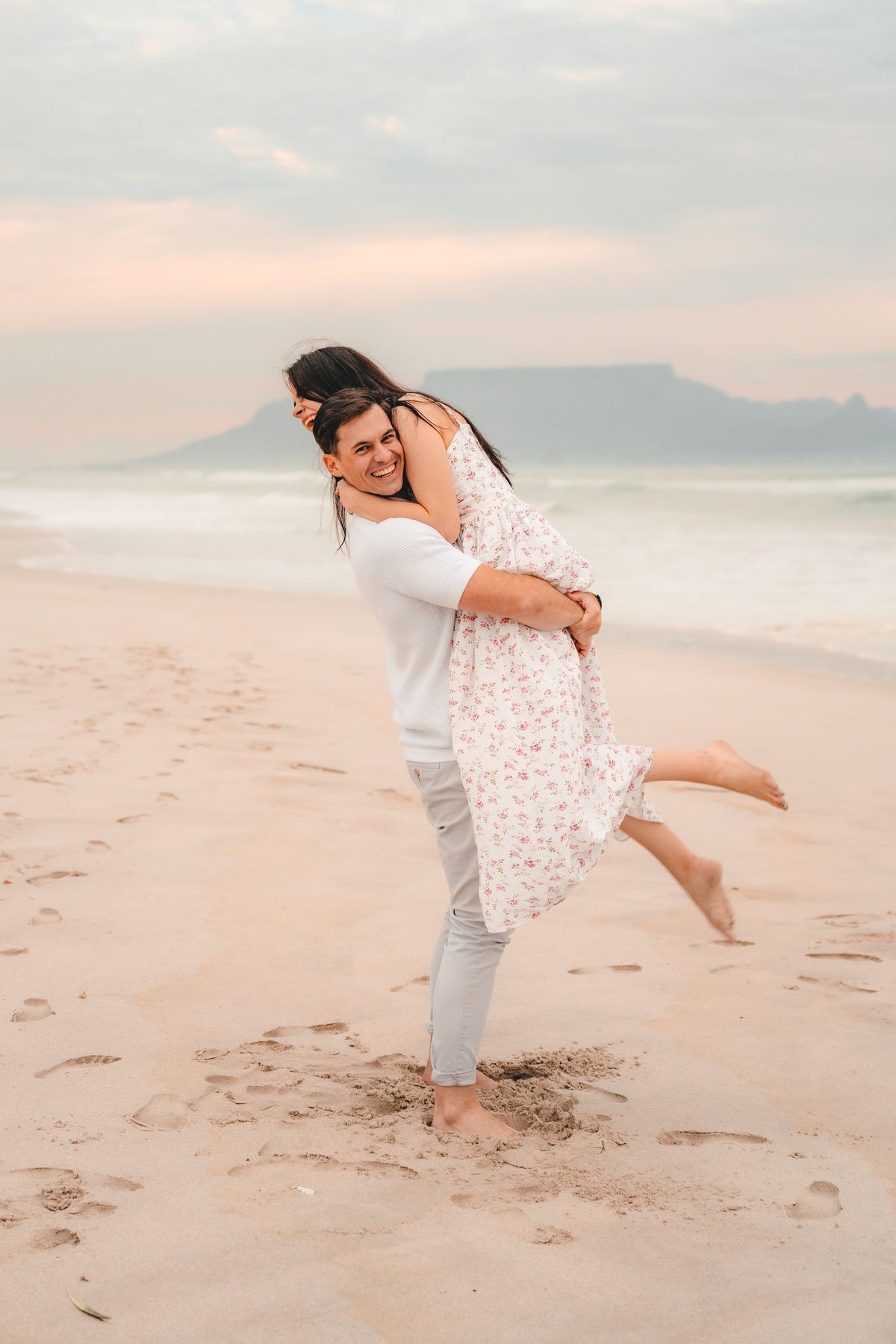Reece and Jessie-Leigh laughing on the beach
